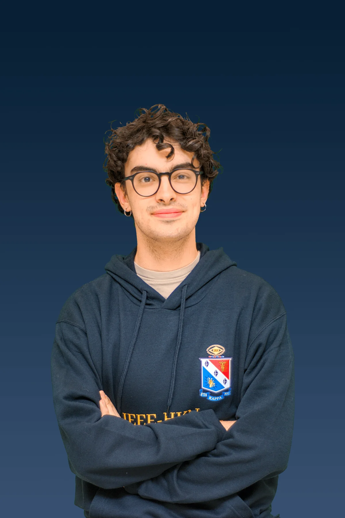Portrait of Simone Romano wearing an IEEE-HKN Mu Nu Chapter hoodie